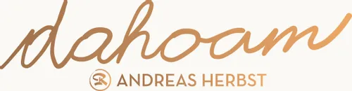 Logo featuring the word 'dahoam' and the name Andreas Herbst in brown-orange tones